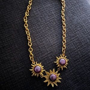 Goldtone necklace with purple flower accents